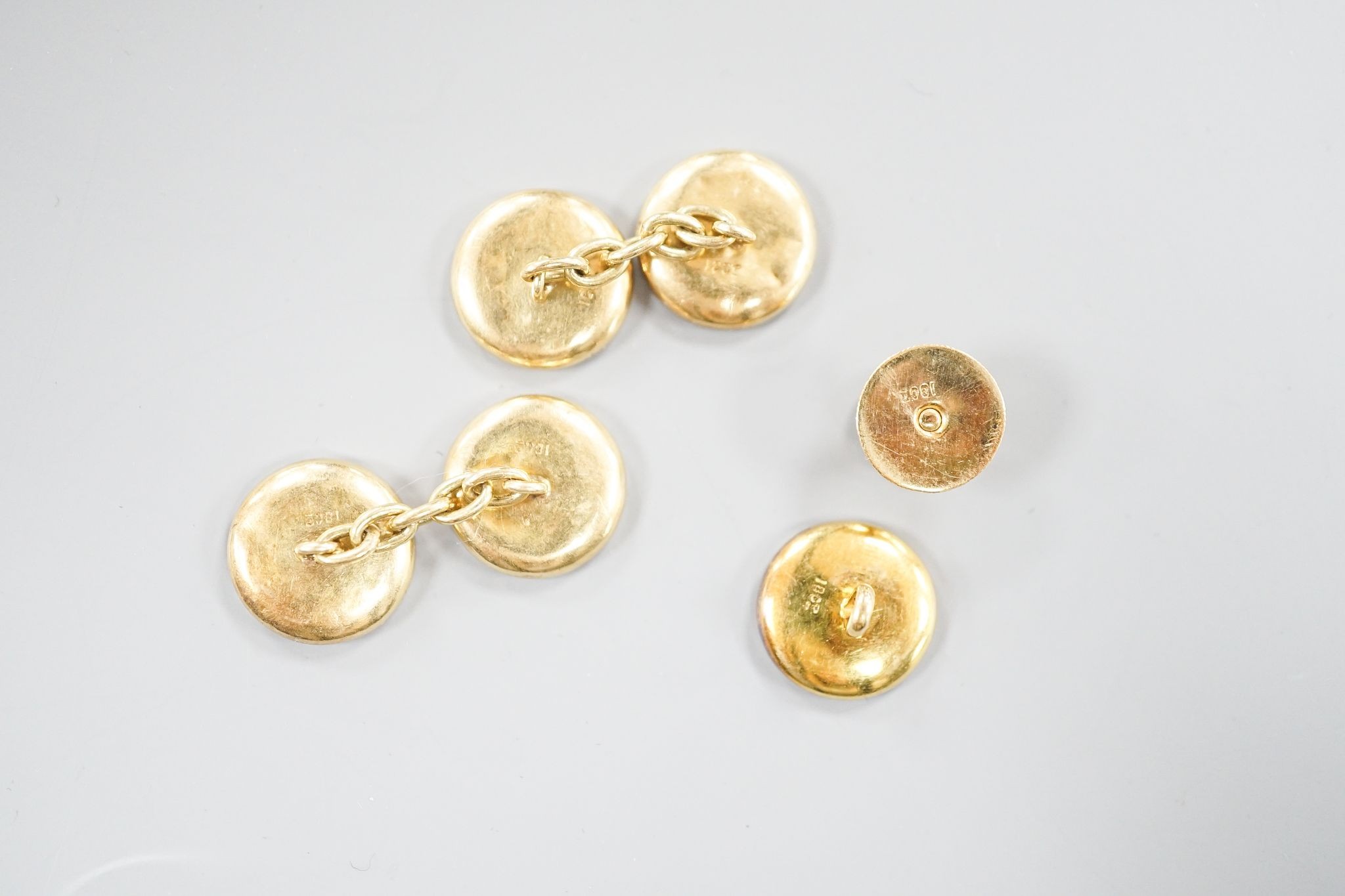 A pair of 18ct, mother of pearl and sapphire set circular cufflinks, 13mm and a pair of matching dress studs, gross weight 8.6 grams.